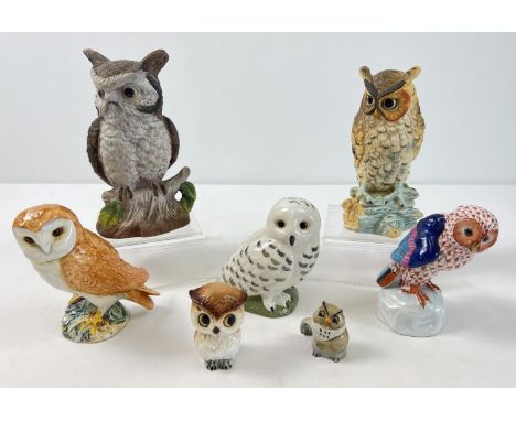 A collection of 7 assorted ceramic owl figurines, to include Beswick, Herend and Wade. 