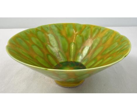A Chinese ceramic bowl with yellow and green spotted design glaze and scalloped rim. Hand painted signature marks to undersid