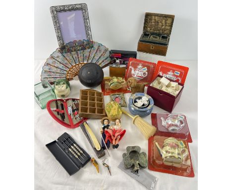 A box of misc. vintage and modern items. To include picture frames, fan, cut throat razor, miniature ceramic teapots, tourist