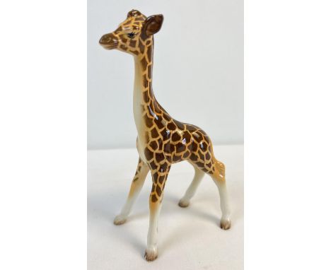 A Beswick ceramic figure of a giraffe, model #853. In gloss finish, approx. 18cm tall. No chips, cracks or signs of damage or