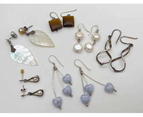 6 pairs of silver and white metal drop style earrings to include mother of pearl (a/f), blue lace agate and tigers eye. Large
