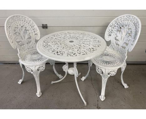 A cast metal 2 seat garden bistro set, painted white, with decorative pierced work detail. Table approx. 69cm diameter. 