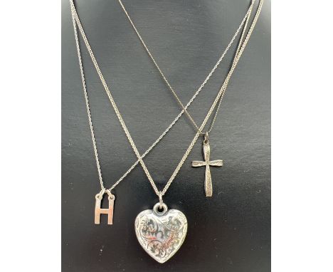 3 silver pendant necklaces. An 18" foxtail chain with a floral decorated heart pendant (white metal), a 16" serpent chain wit