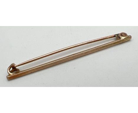 A vintage gold bar brooch/tie pin. Not marked, tests as 9ct gold. Approx. 5cm long, weight approx. 1.5g. 