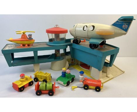 A vintage Fisher Price Airport. With passenger plane, helicopter, luggage carts, cars, figures and jet fuel tank. Age related