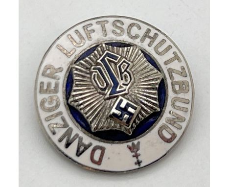A World War II style Danziger Luftschutzbund circular pin badge with white enamel detail. Possibly reproduction. Approx. 2.5c