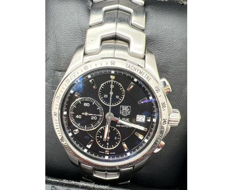 A boxed Link automatic chronograph Tachymeter wristwatch (EBQ8801) by Tag Heuer. Stainless steel strap and case with black fa