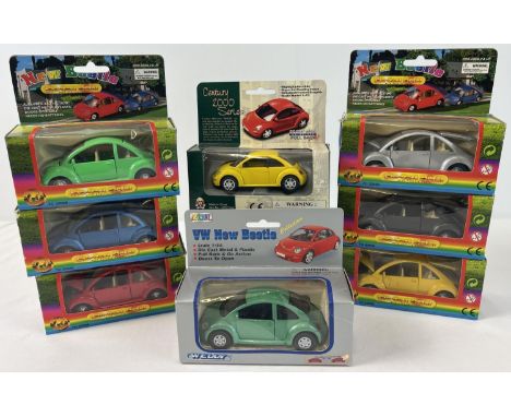 8 assorted boxed 1/36 scale diecast models of Volkswagen Beetle cars. All with pull back action and opening doors. To include