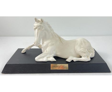 A Royal Doulton "Spirit Of Peace" white porcelain horse figurine on a wooden plinth with name plate. Approx. 15cm x 30cm. 
