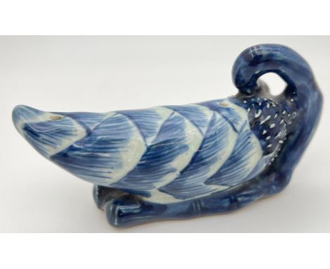 A Chinese ceramic blue and white hand painted brush rest in the form of a Chinese bitter melon. Approx. 8cm tall x 14cm long.