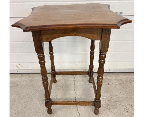 A dark wood vintage occasional table with turned legs and shaped top. Approx. 76cm x 74cm. 