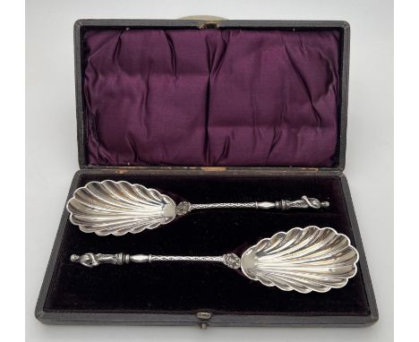 A pair of decorative William Hutton &amp; sons silver plated serving spoons in original period case with purple velvet interi
