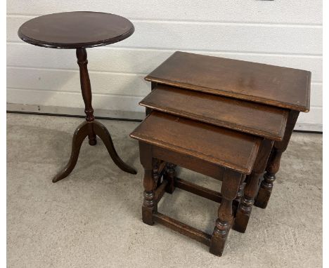 A vintage dark wood nest of tables with turned legs and carved decoration. Together with a small circular tripod leg occasion