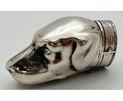 A novelty silver vesta case modelled as a dogs head, with striking panel to underside. Hinged lid in the form of the collar. 