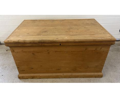 A large vintage pine blanket box with drop down handles to each end. Approx. 59cm x 112cm x 56cm. 