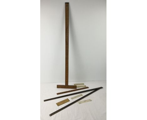 A collection of assorted antique &amp; vintage rules to include wooden examples. Lot includes 5 small architectural scale rul