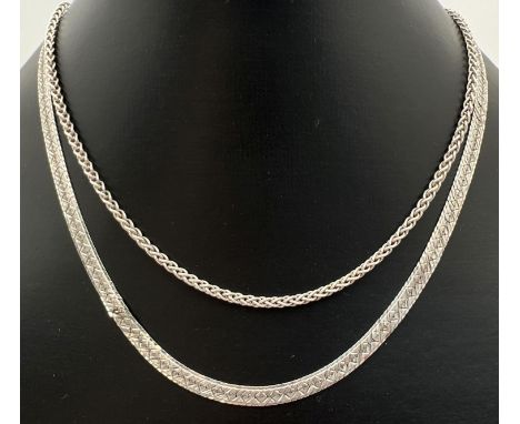 2 vintage silver chain necklaces. A 15" Fox tail chain with lobster claw clasp and a 16" patterned herringbone style necklace