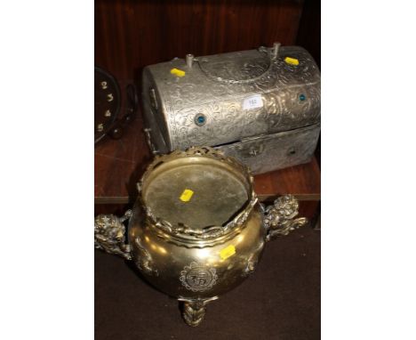 A DECORATIVE BRASS URN TOGETHER WITH A WHITE METAL TRUNK