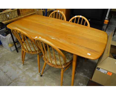 An Ercol table and four chairs.