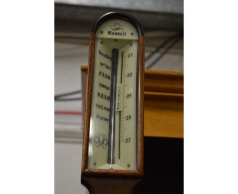 A reproduction mahogany ships stick barometer.