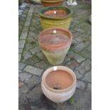 Three terracotta plant pots.