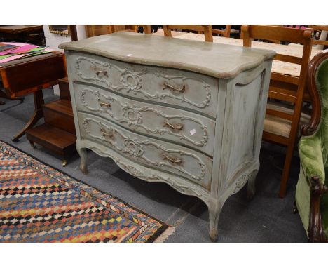 A large French three drawer commode with distressed green painted finish.