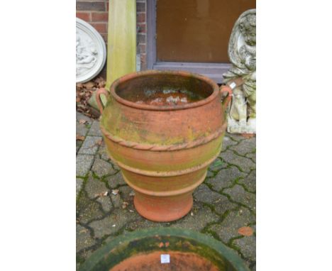 A large terracotta planter.