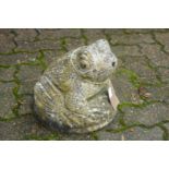 A reconstituted stone garden fountain modelled as a frog.