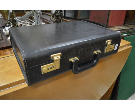 A Coach gentleman's black leather briefcase.