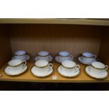 A set of eight Coalport Elite-Gold coffee cups and saucers.
