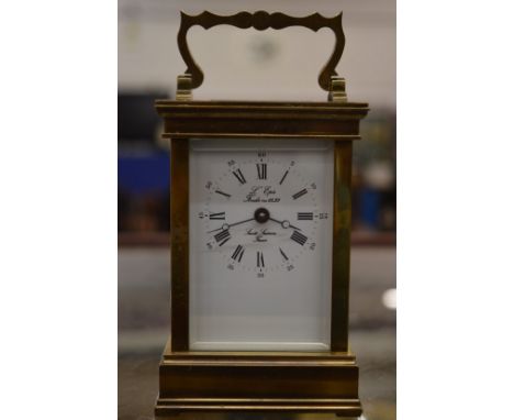 A brass carriage clock.