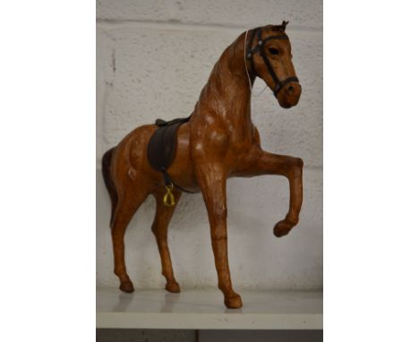 An unusual leather model of a prancing horse.