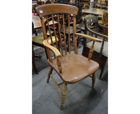 A 19th century beech and elm stick back Windsor armchair.