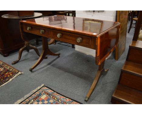 A Regency rosewood and satinwood banded sofa table (faults).