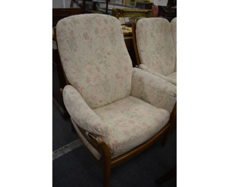 A modern light elm Ercol two seater settee and matching armchair.