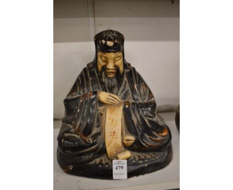 A Chinese lacquer model of a seated Buddha.