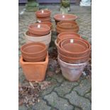 A quantity of terracotta plant pots.