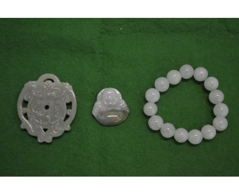 Chinese jade amulets together with a bead bangle.