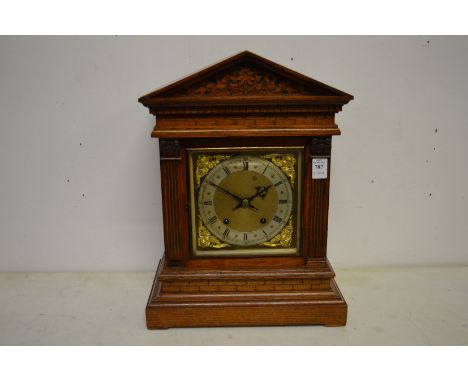 A good oak architectural case mantle clock.