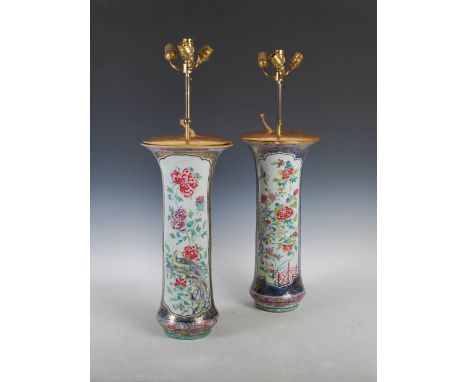 A pair of Chinese porcelain famille rose sleeve vases, Qing Dynasty, decorated with panels of long tailed birds and peony, mo