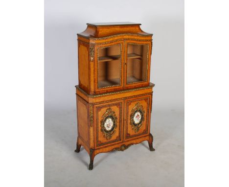 A fine 19th century satinwood, kingwood, ormolu and porcelain mounted side cabinet, the rectangular top above a pair of glaze