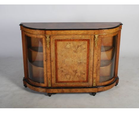 A Victorian walnut, marquetry and gilt metal mounted credenza, the shaped rectangular top above a central panelled cupboard d