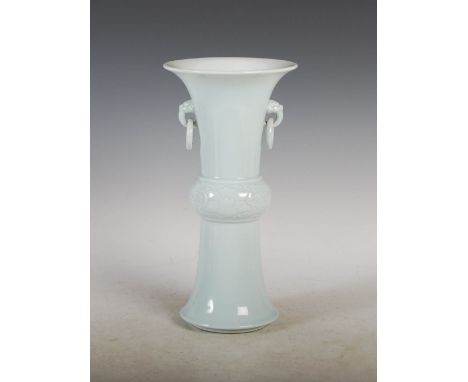 A Chinese porcelain Clare-de-lune glazed gu form vase, Republic Period, the centre section with incised decoration of peony a