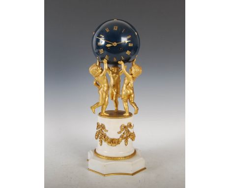 A late 19th century French ormolu and marble mantle clock, the blue patinated globe dial with Roman numerals and applied star