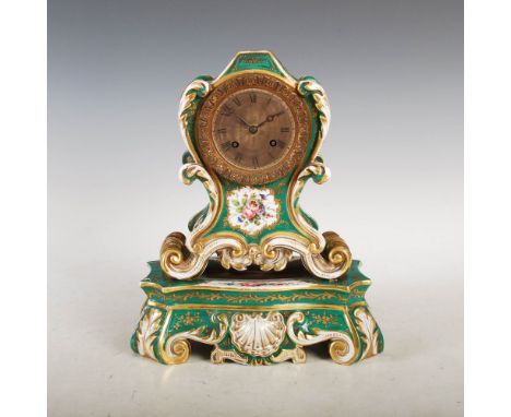 A 19th century Paris porcelain green ground Rococo style mantle clock, the 3 1/4 inch engine turned dial with Roman numerals,