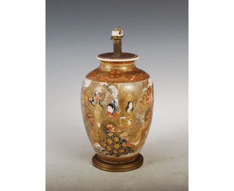 A Japanese Satsuma pottery vase, Meiji Period, decorated with lohan within richly gilded borders, mounted as a table lamp wit
