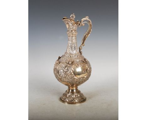 A Victorian silver claret jug, London, 1898, makers mark of G.&Co. LD., the circular body with two vacant shield shaped panel