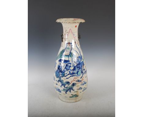 A Chinese porcelain famille rose crackle glazed pear-shaped vase, Qing Dynasty, decorated on one side with warriors and figur