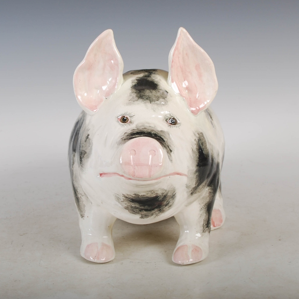 A Wemyss Ware pottery pig, with black markings and pink details ...