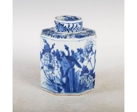 A Chinese porcelain blue and white octagonal shaped tea caddy and cover, Qing Dynasty, decorated with peony, chrysanthemum an